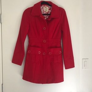 Red peacoat with button detail